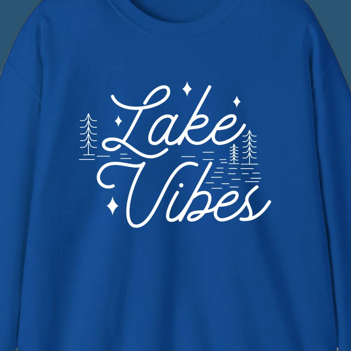 Lake Vibes text with pine trees and stars, nature-inspired lake graphic.