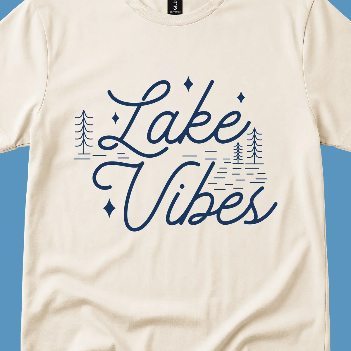 Lake Vibes text with pine trees and stars, nature-inspired lake graphic.