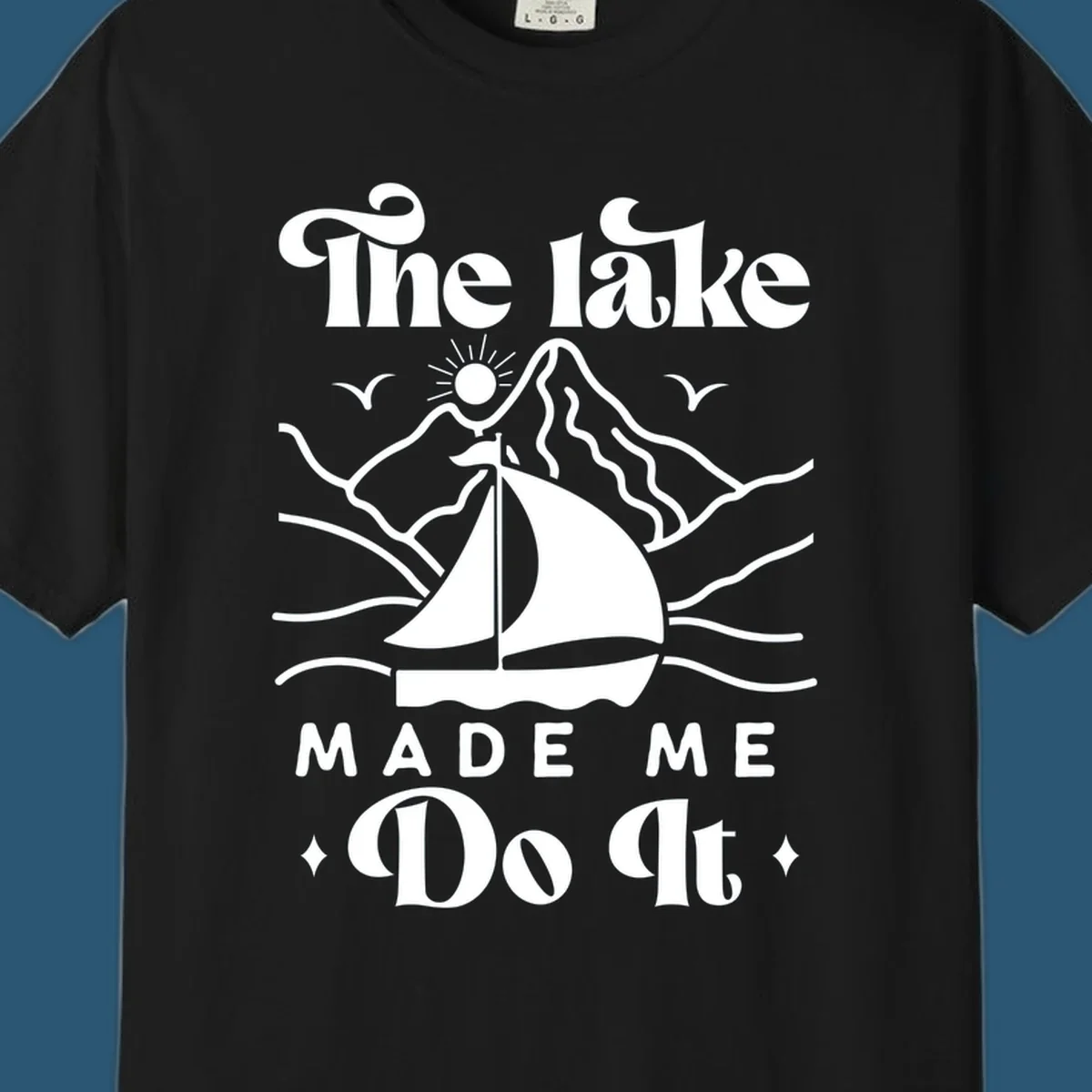 The lake Made Me Do It sailboat illustration with mountains and birds, lake-made-me-do-it concept.