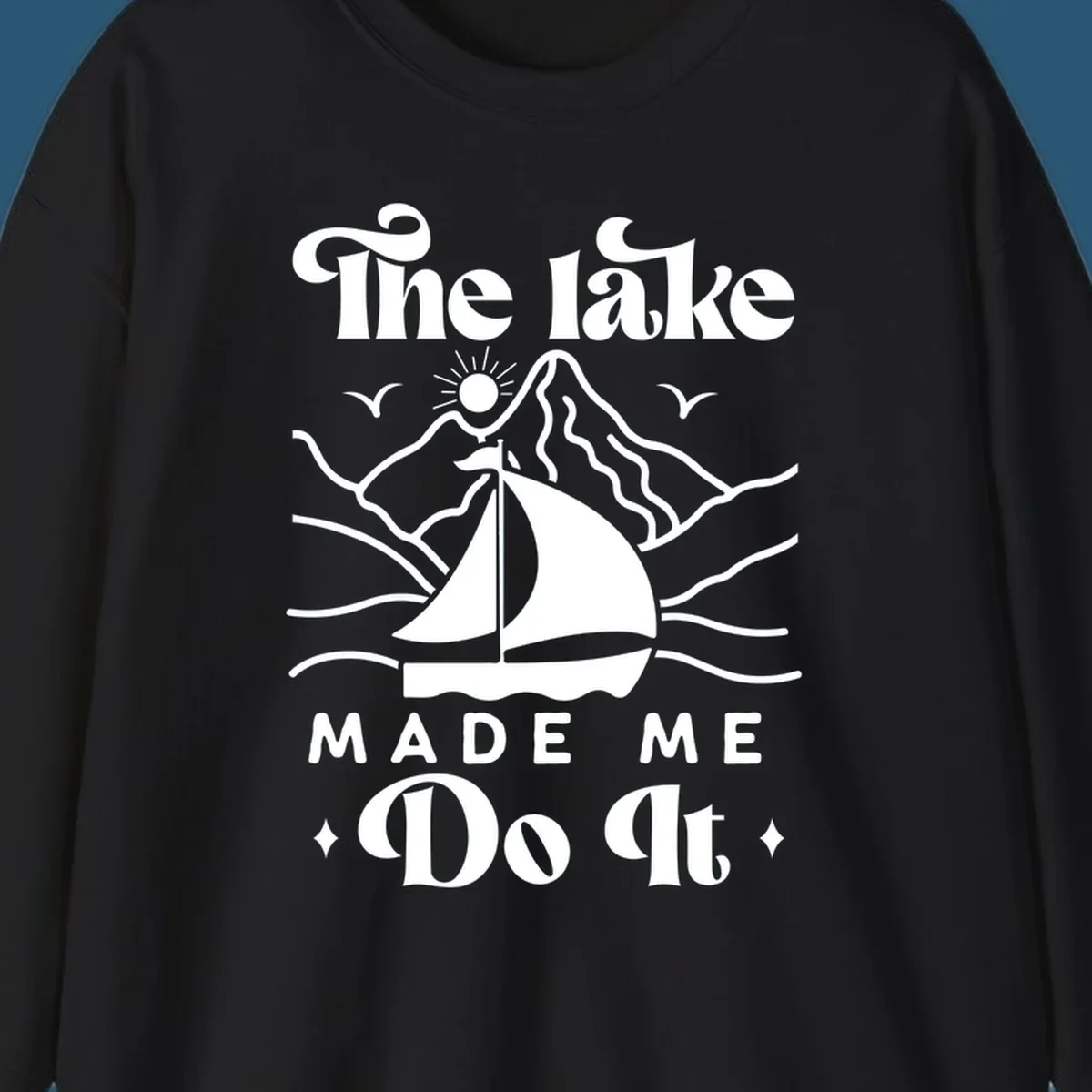 The lake Made Me Do It sailboat illustration with mountains and birds, lake-made-me-do-it concept.