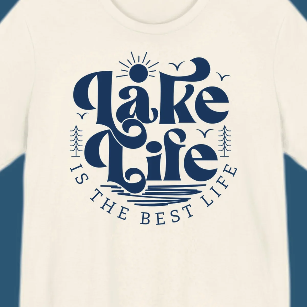 Lake life is the best life typography design with sun, birds, trees, and water elements.