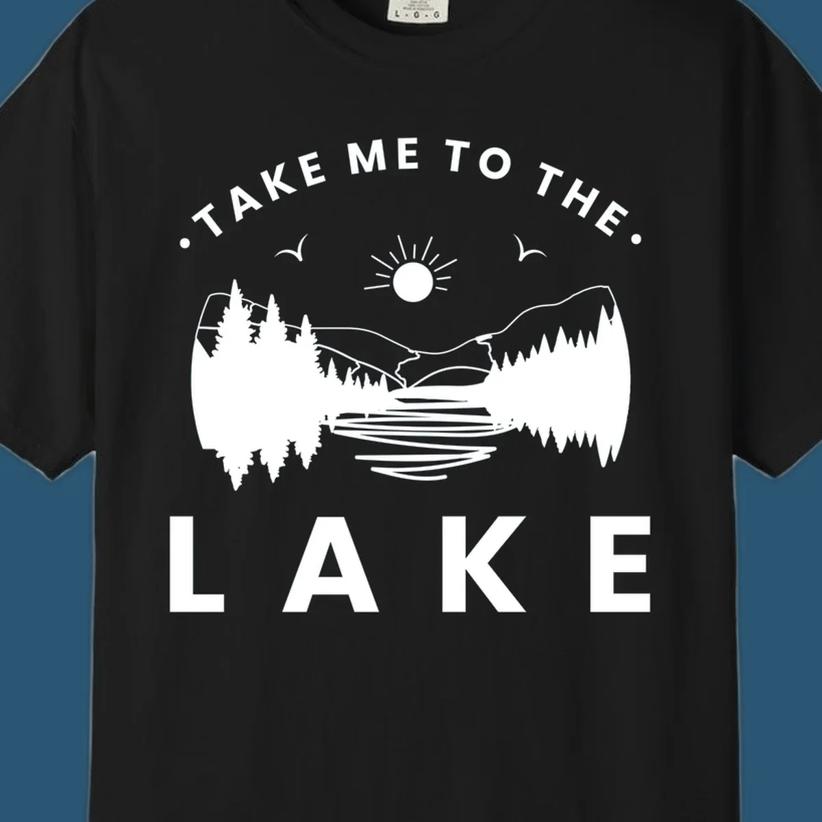 Take me to the lake mountains design with text and scenic illustration.