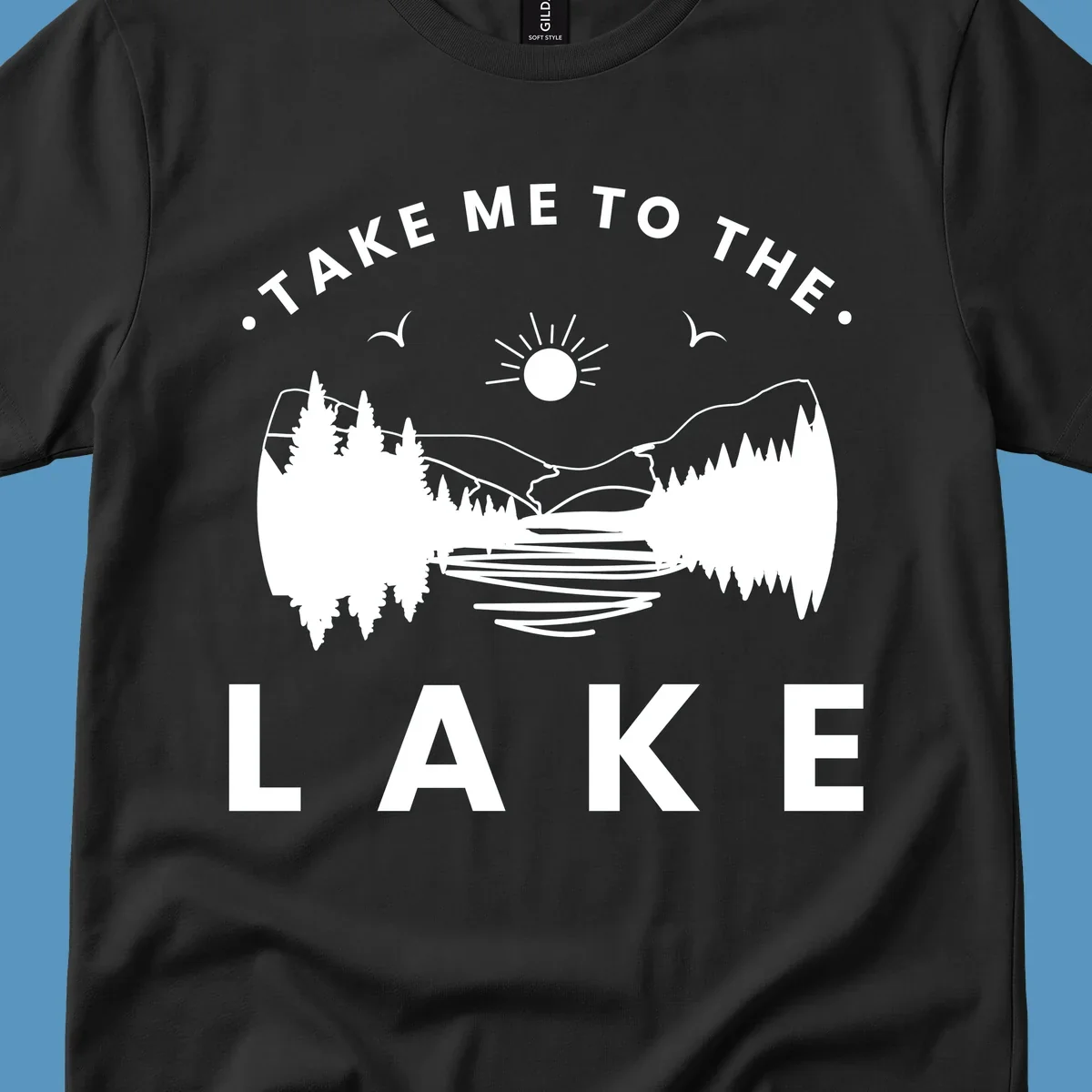 Take me to the lake mountains design with text and scenic illustration.