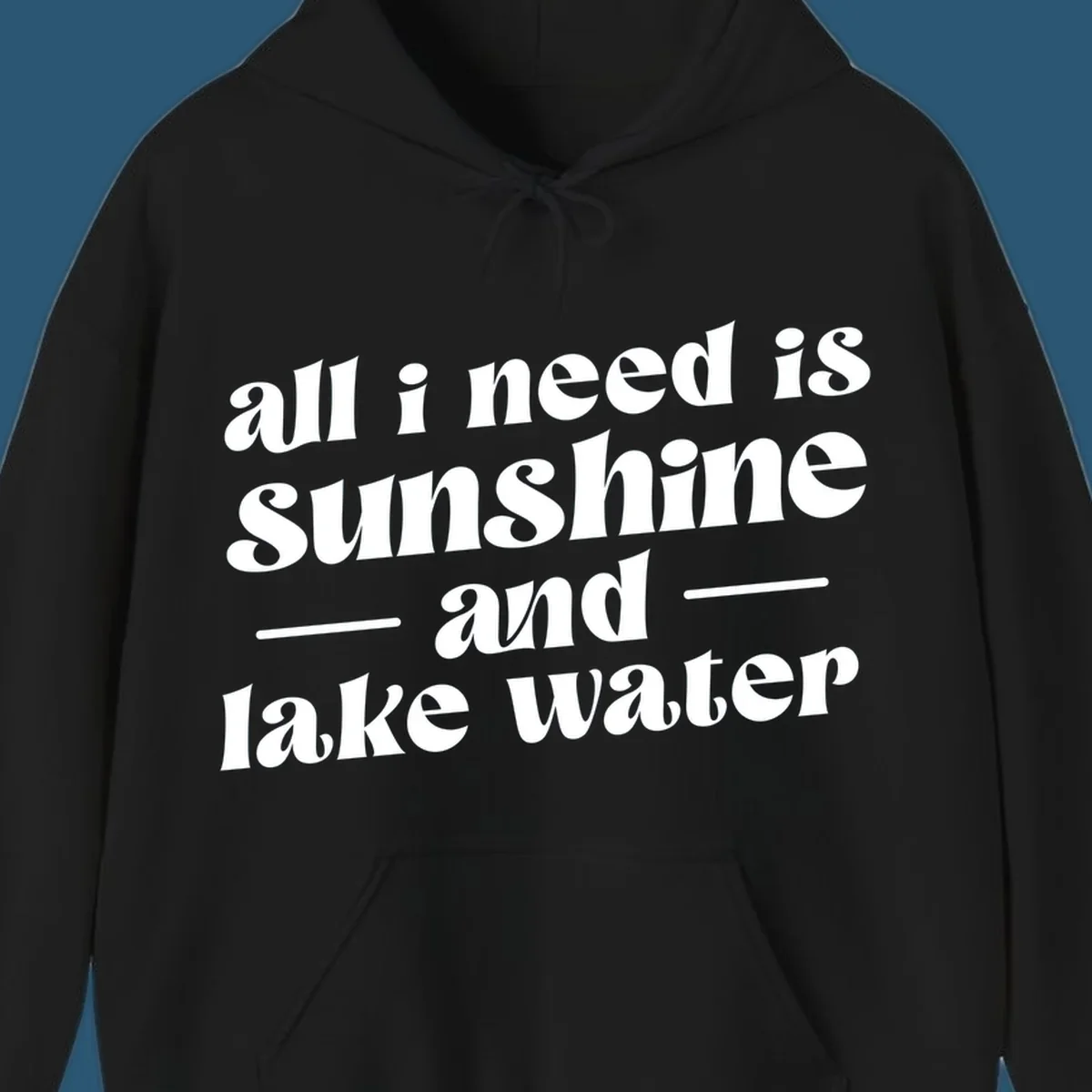 Text design 'all i need is sunshine and lake water' in a retro font, perfect for lake days.
