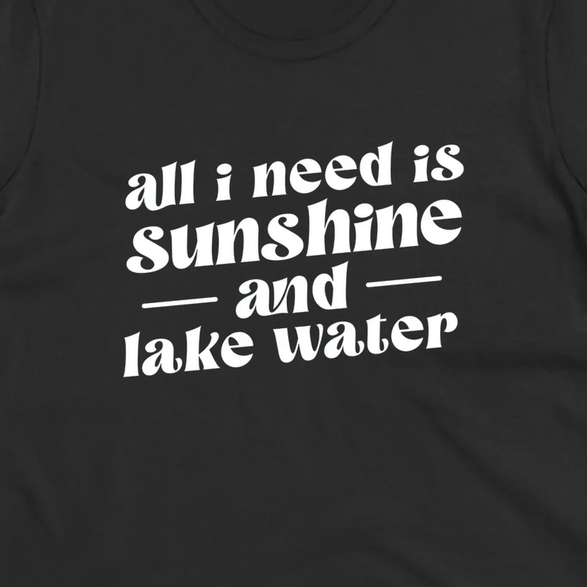 Text design 'all i need is sunshine and lake water' in a retro font, perfect for lake days.