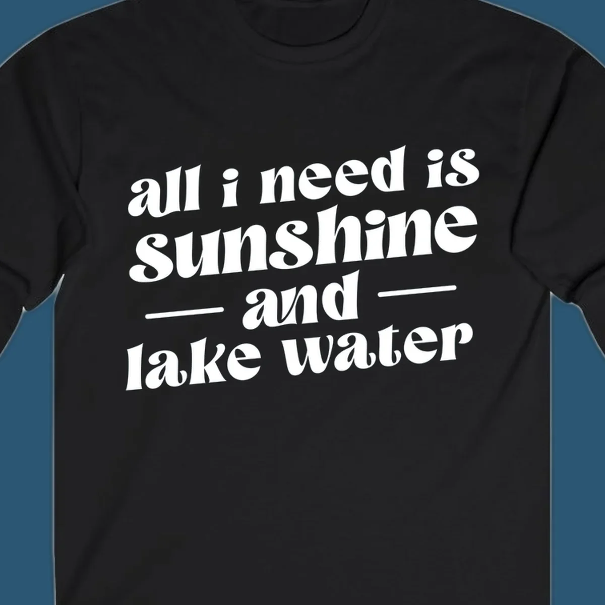 Text design 'all i need is sunshine and lake water' in a retro font, perfect for lake days.