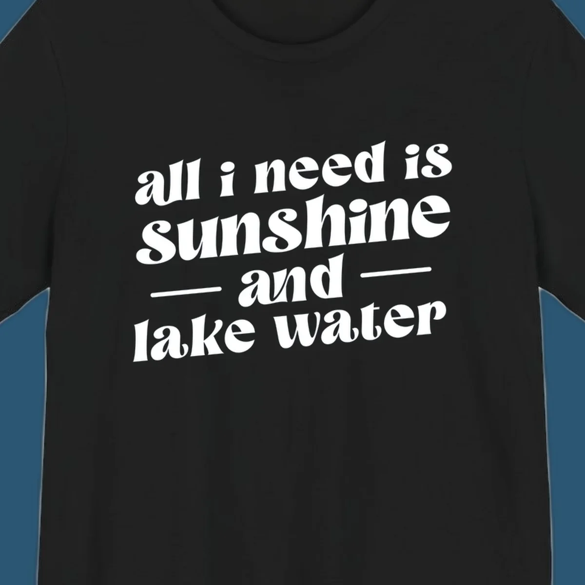 Text design 'all i need is sunshine and lake water' in a retro font, perfect for lake days.