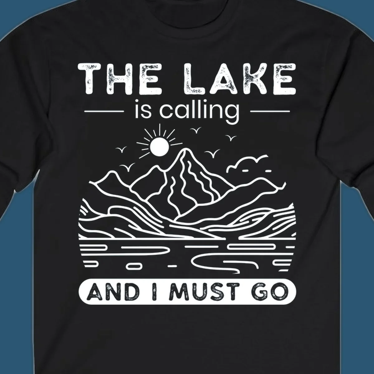 The Lake is Calling And I Must Go scenic nature design with mountains and lake.