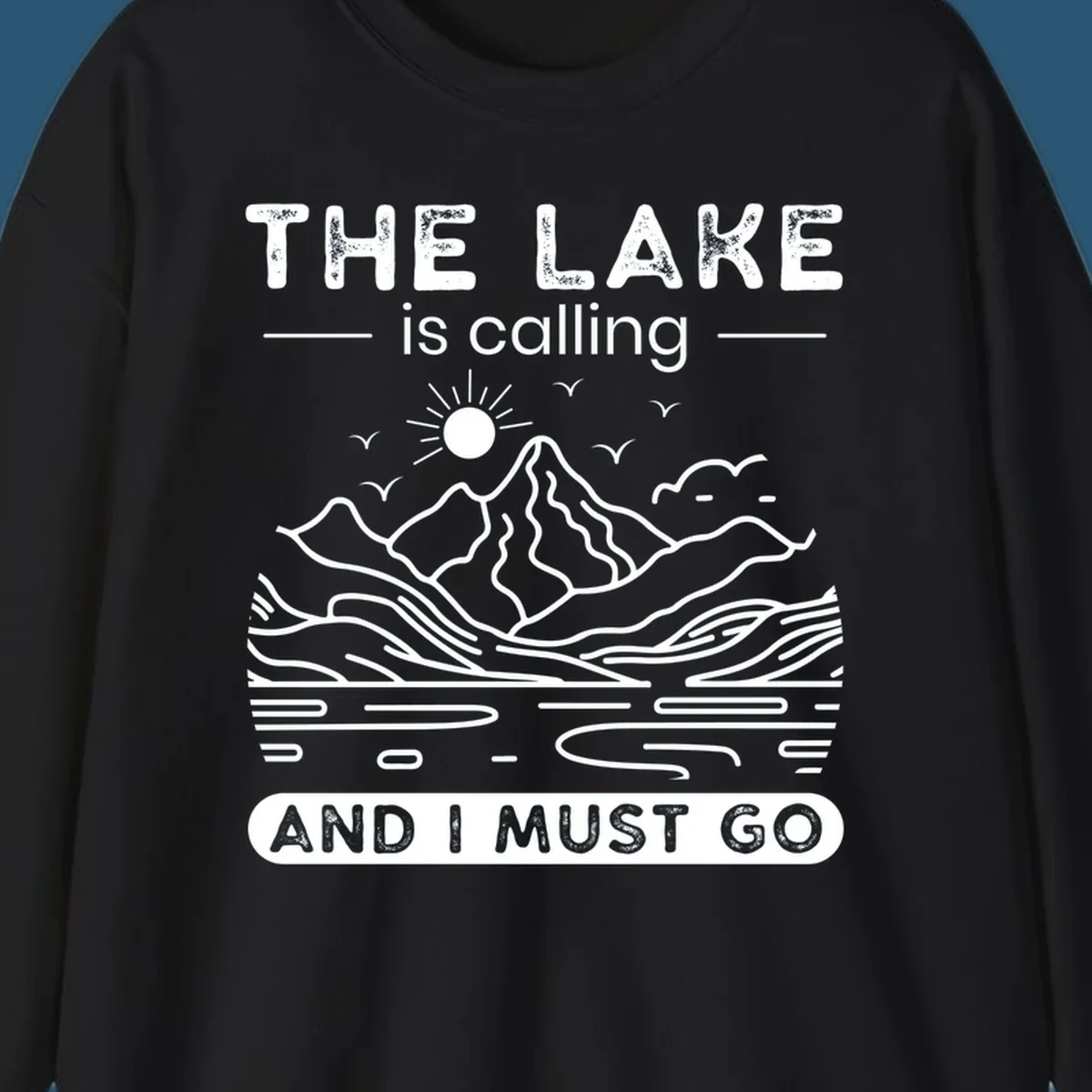 The Lake is Calling And I Must Go scenic nature design with mountains and lake.