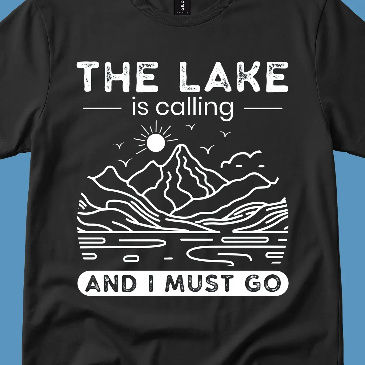 The Lake is Calling And I Must Go scenic nature design with mountains and lake.