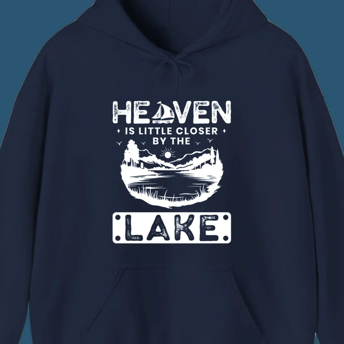 Heaven Is Little Closer By The Lake scenic design with lake, mountains, and sailboat.