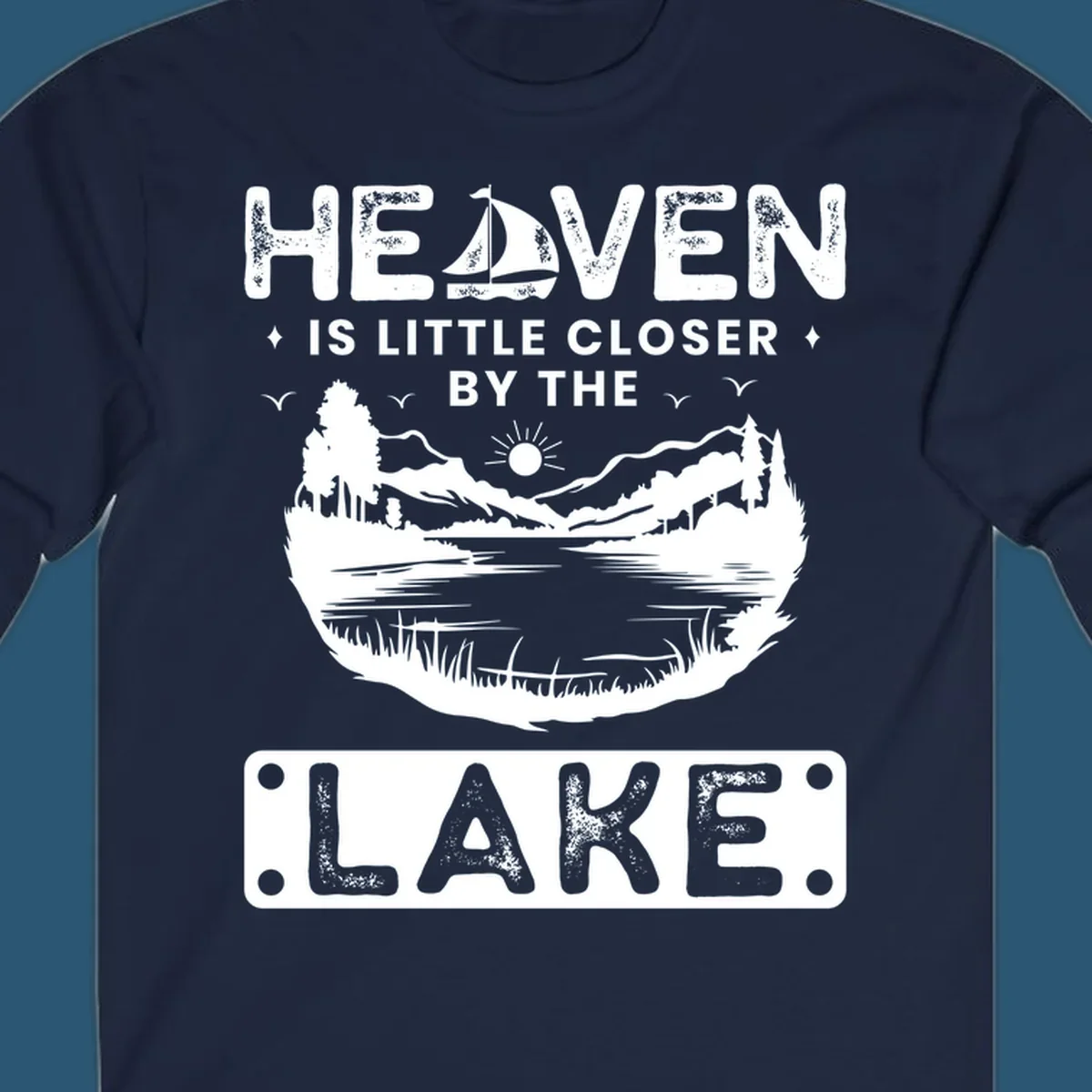 Heaven Is Little Closer By The Lake scenic design with lake, mountains, and sailboat.