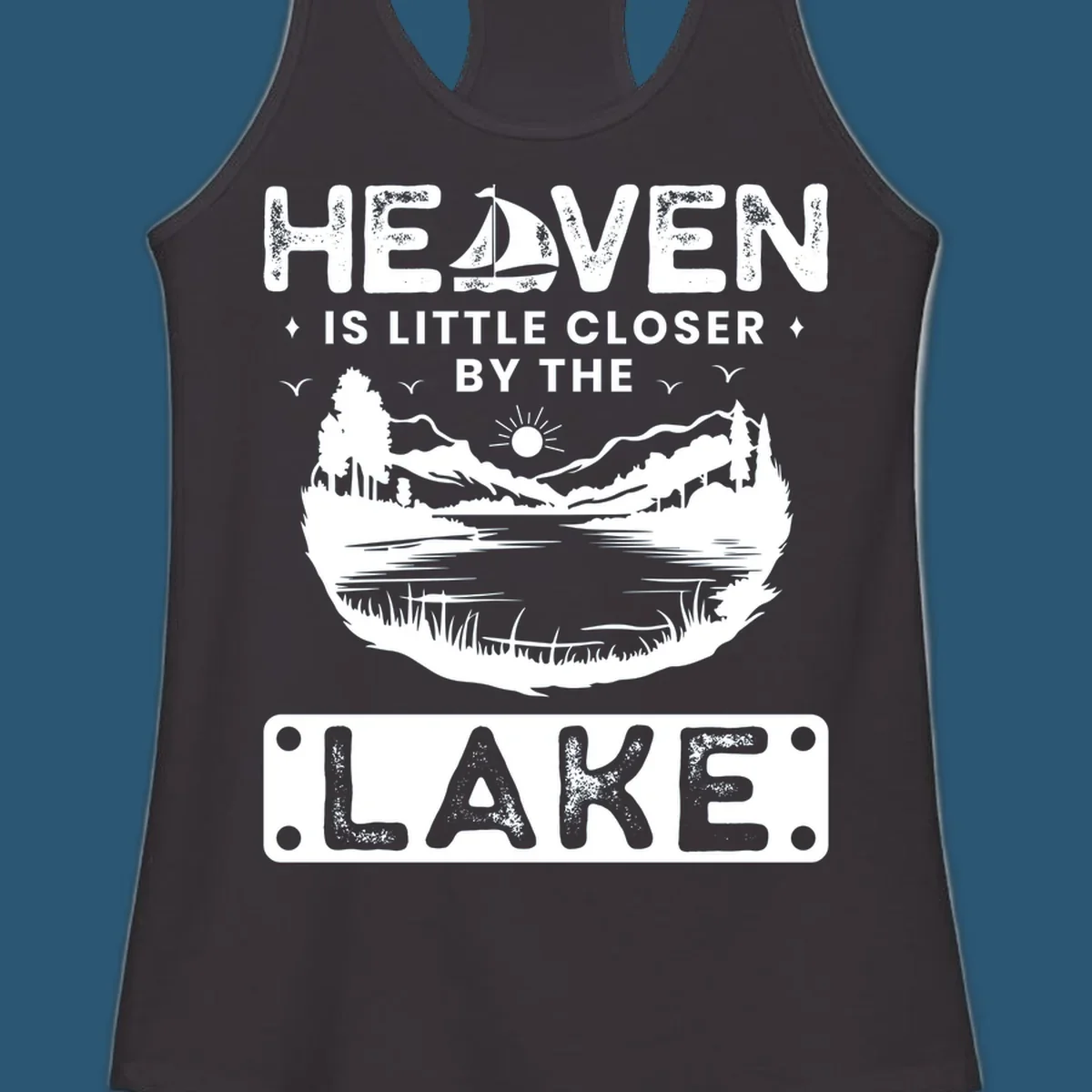 Heaven Is Little Closer By The Lake scenic design with lake, mountains, and sailboat.