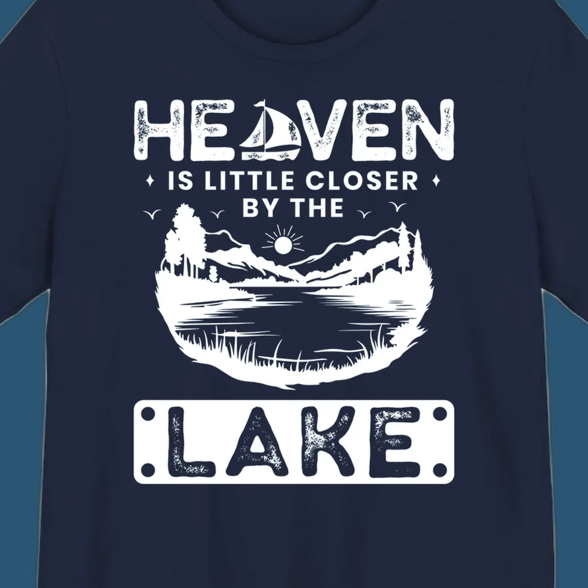 Heaven Is Little Closer By The Lake scenic design with lake, mountains, and sailboat.