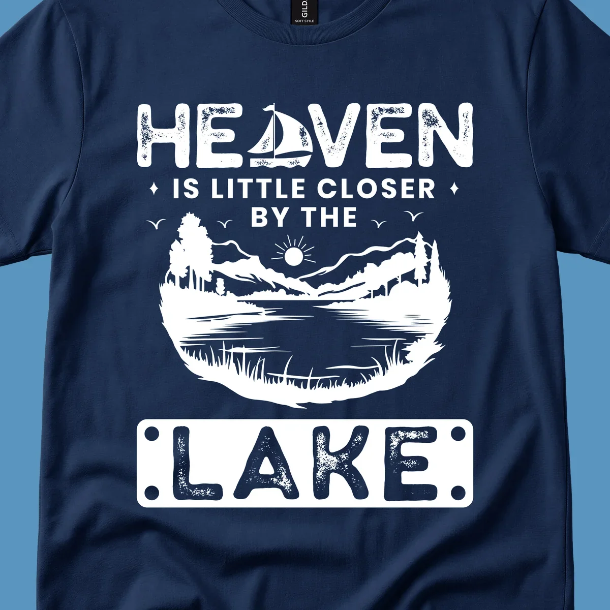Heaven Is Little Closer By The Lake scenic design with lake, mountains, and sailboat.