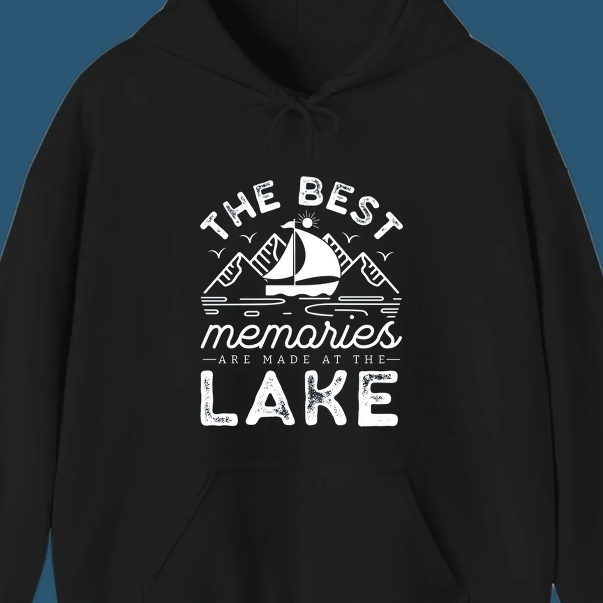 The Best Memories Are Made At The Lake design with mountains, sailboat, and text.