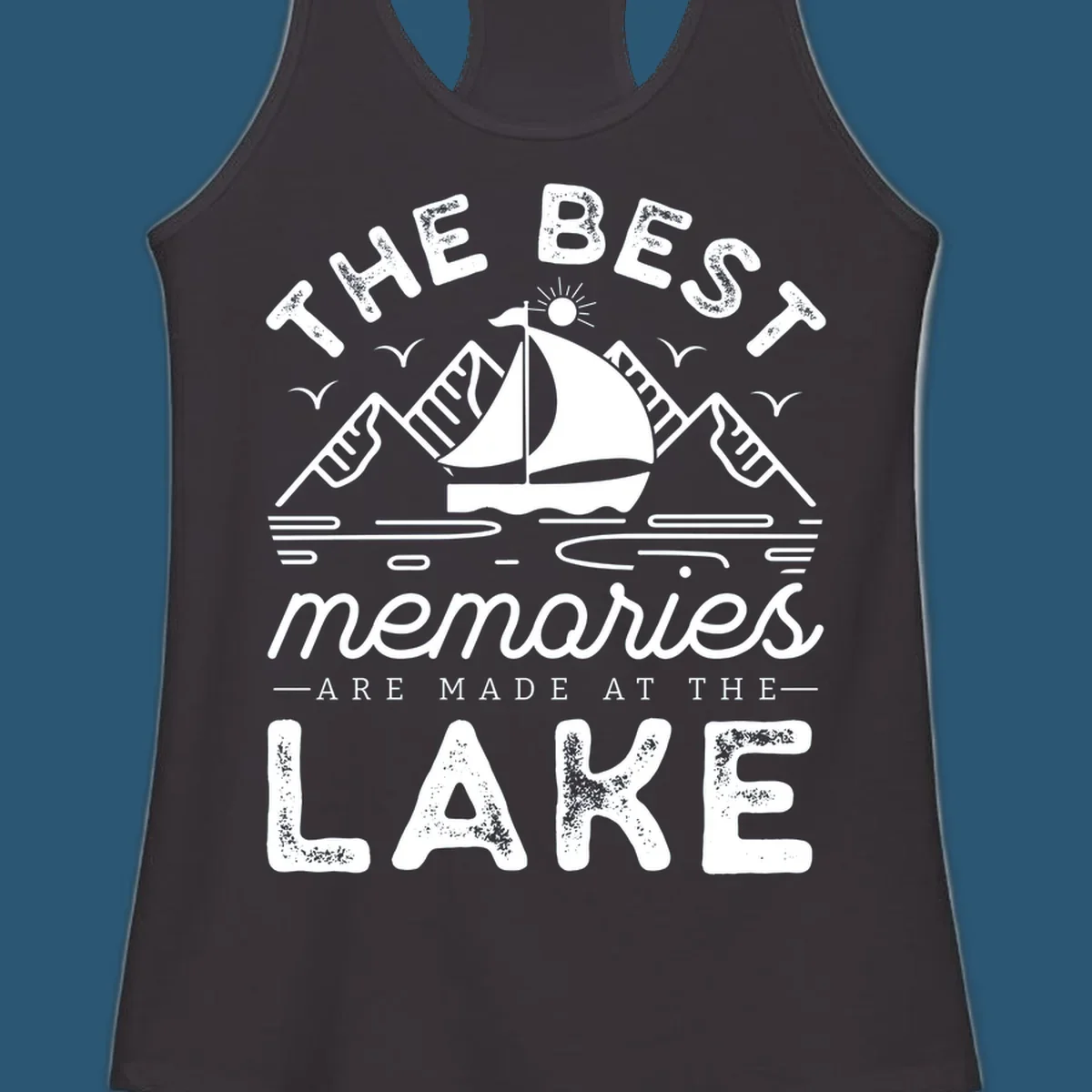 The Best Memories Are Made At The Lake design with mountains, sailboat, and text.