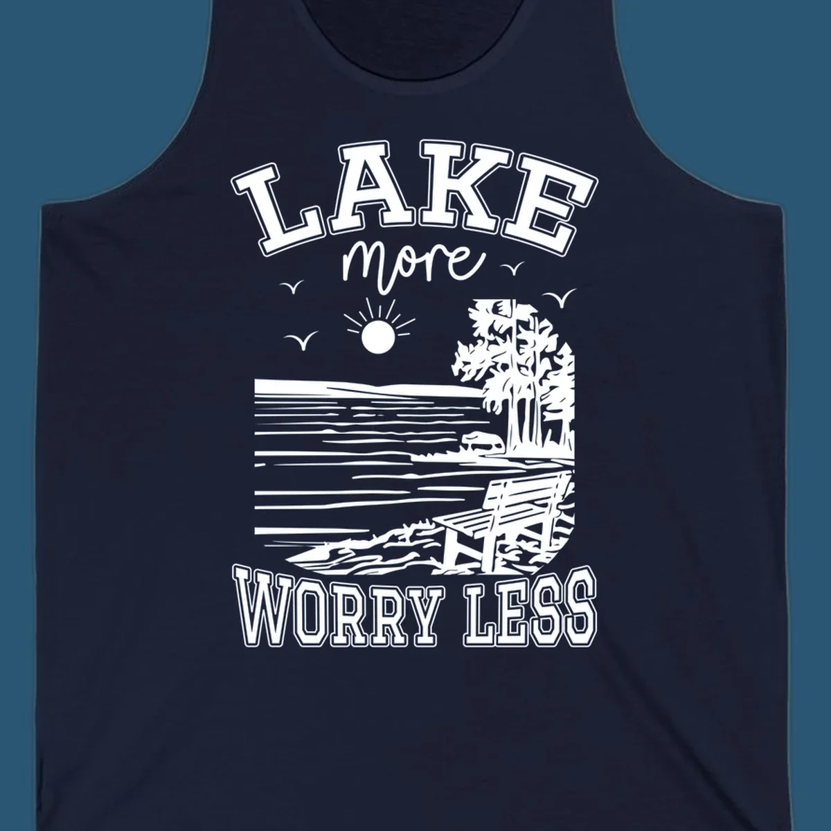 Lake More Worry Less scenic illustration with lake, trees, bench, and sun, white text on black, navy text on white.