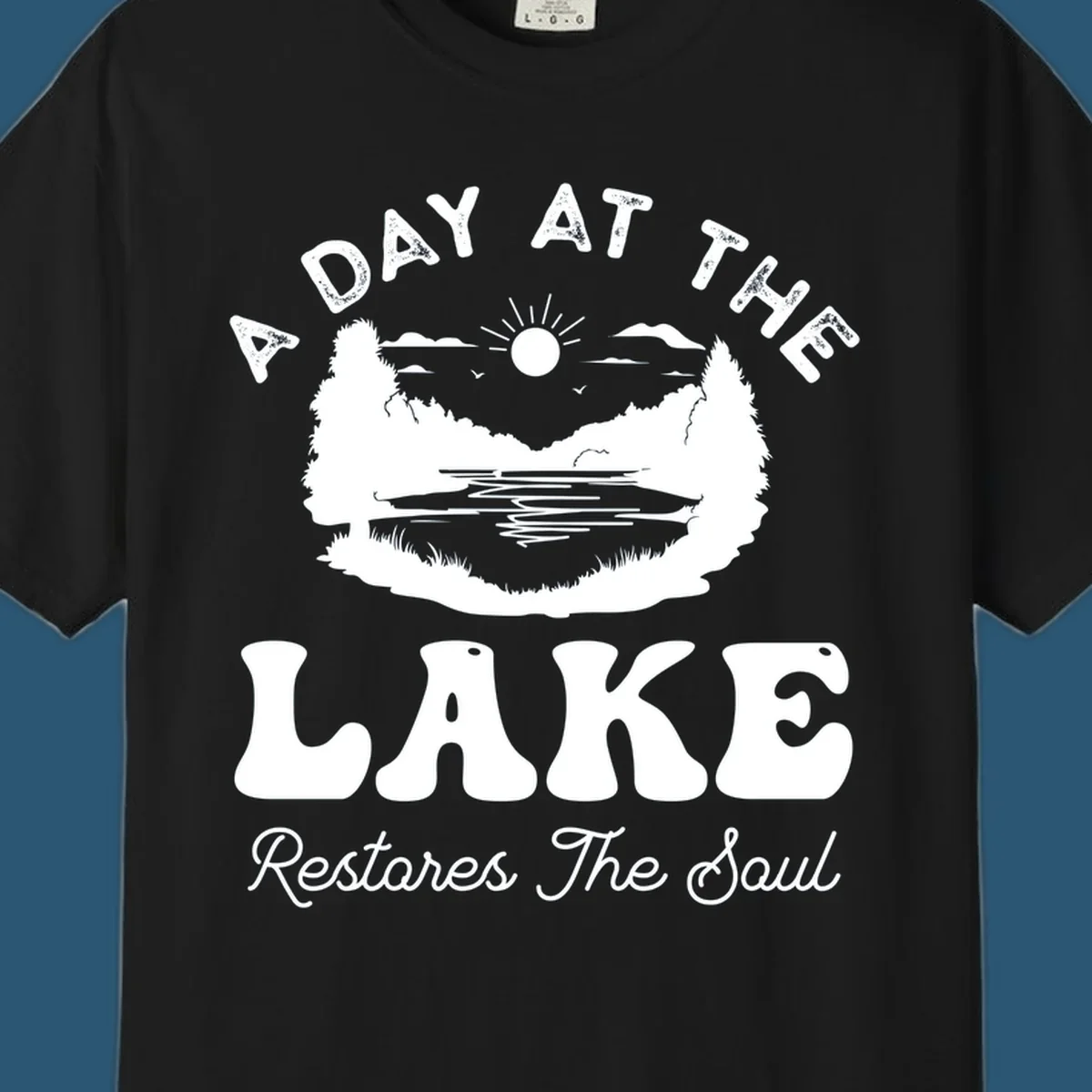 A day at the lake restores the soul graphic with lake scene and text