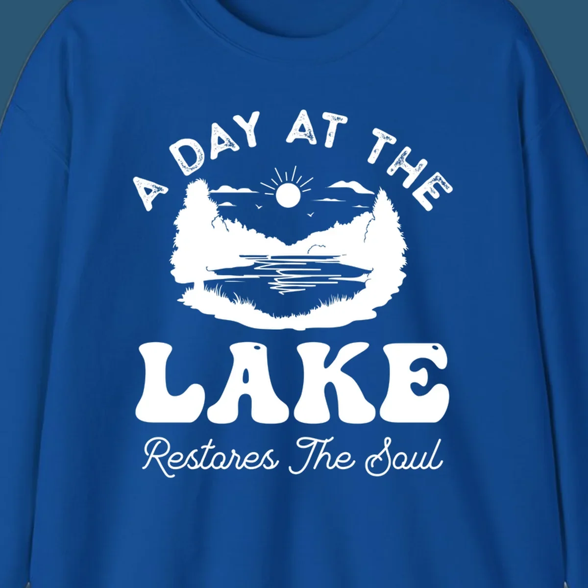 A day at the lake restores the soul graphic with lake scene and text