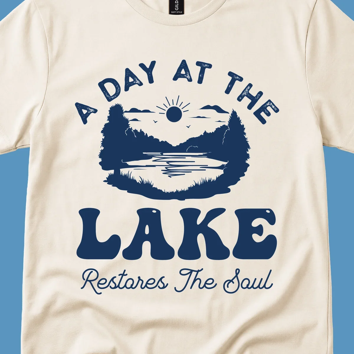 A day at the lake restores the soul graphic with lake scene and text