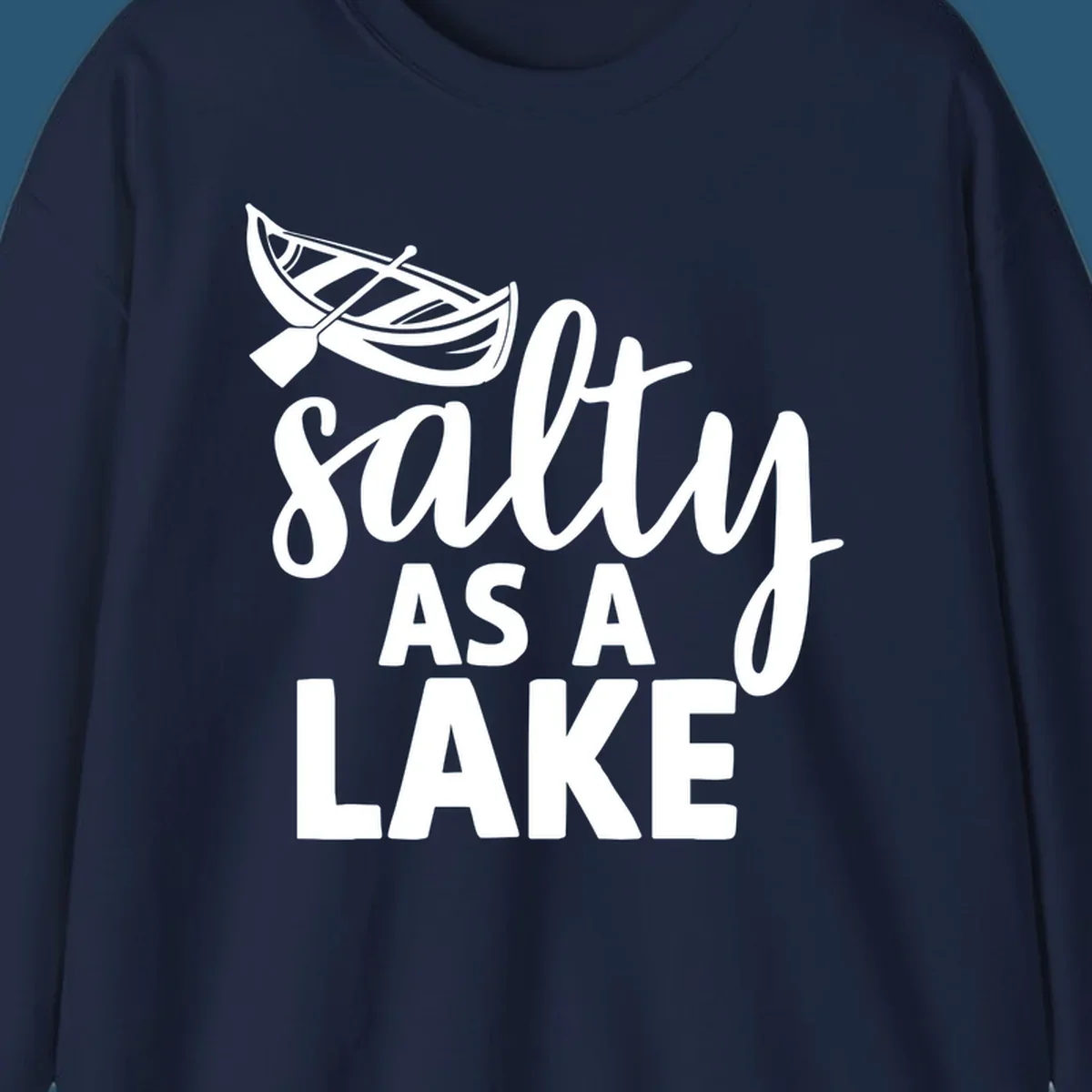 Salty As A Lake typography with canoe illustration.
