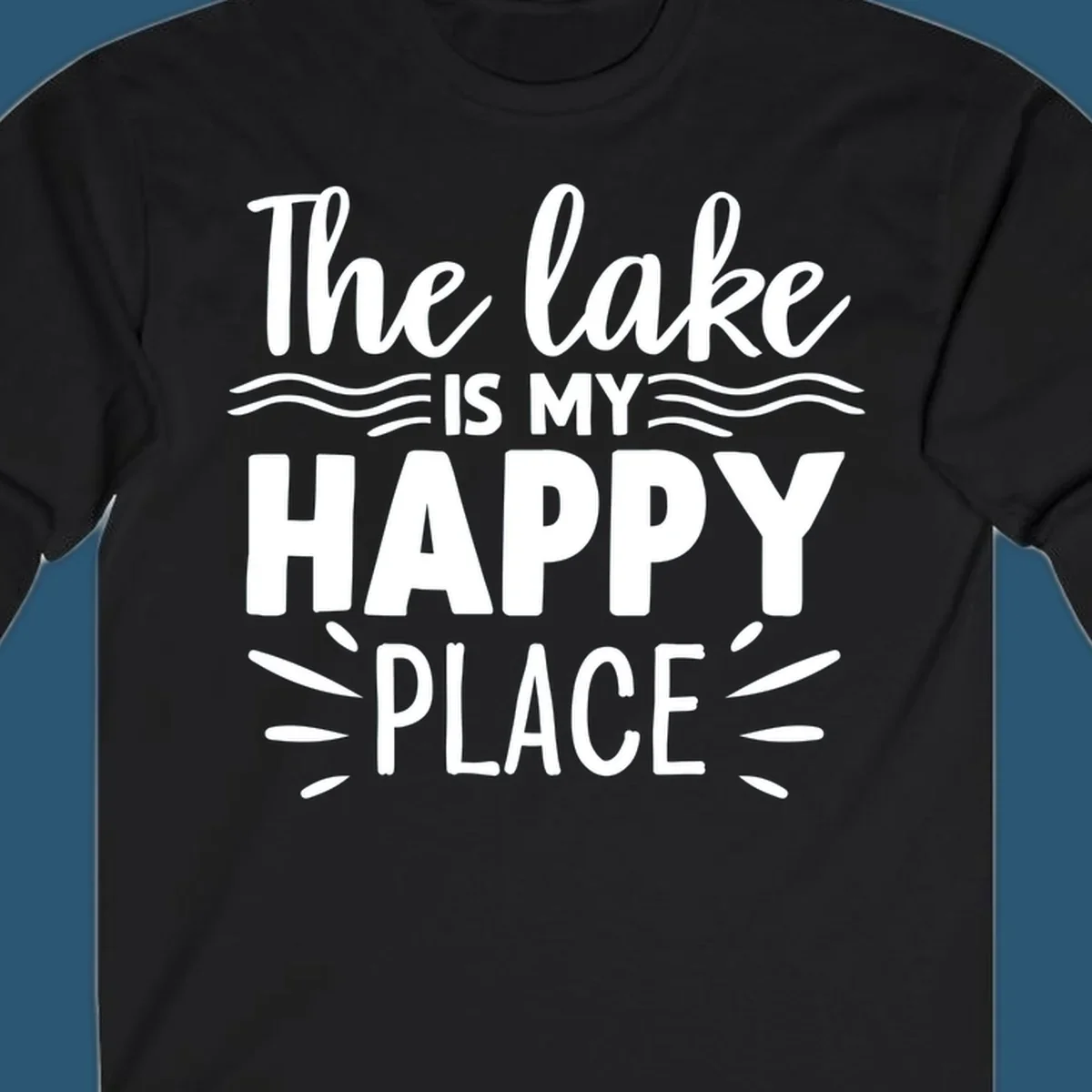 The lake is my happy place text design with wave and sun ray graphics.
