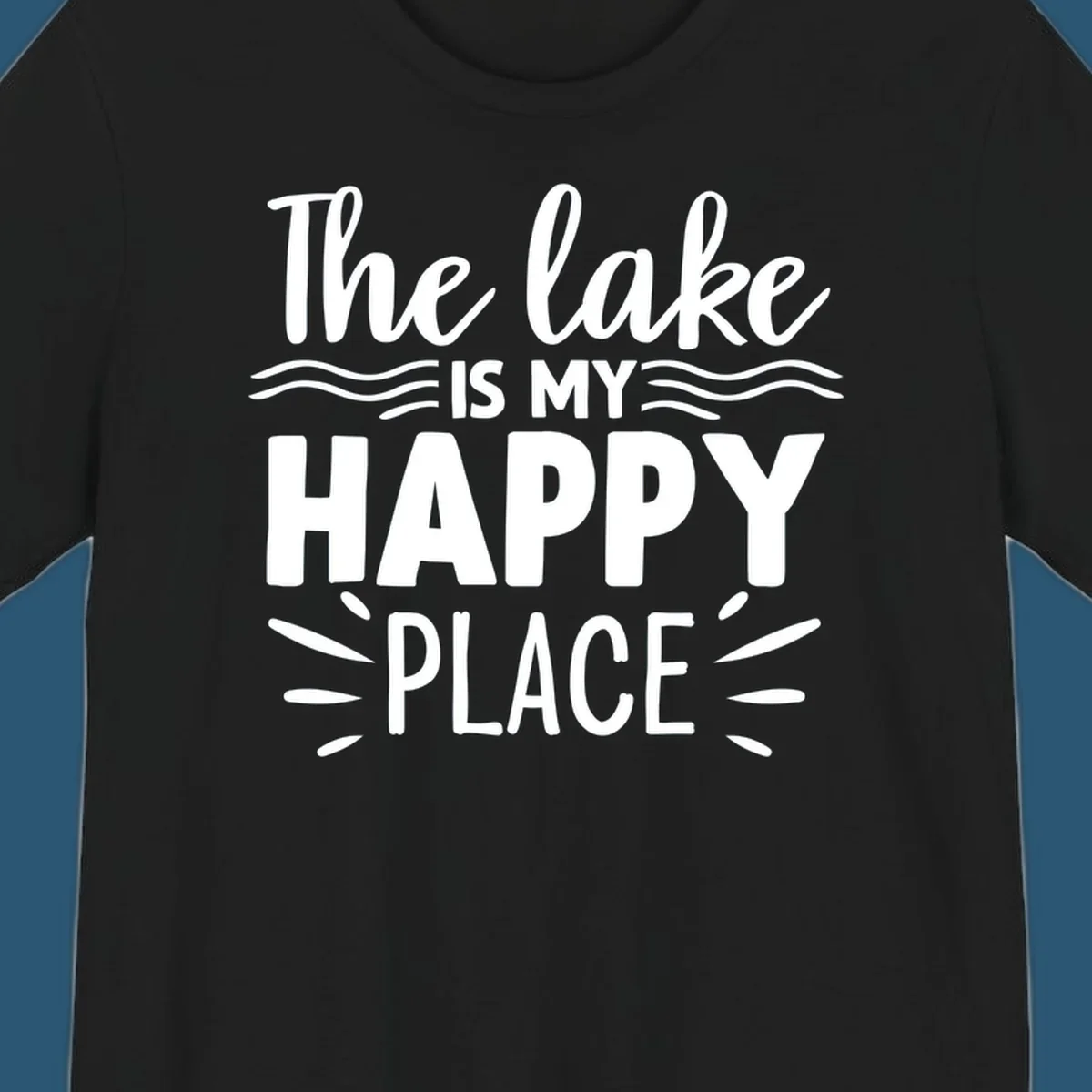 The lake is my happy place text design with wave and sun ray graphics.