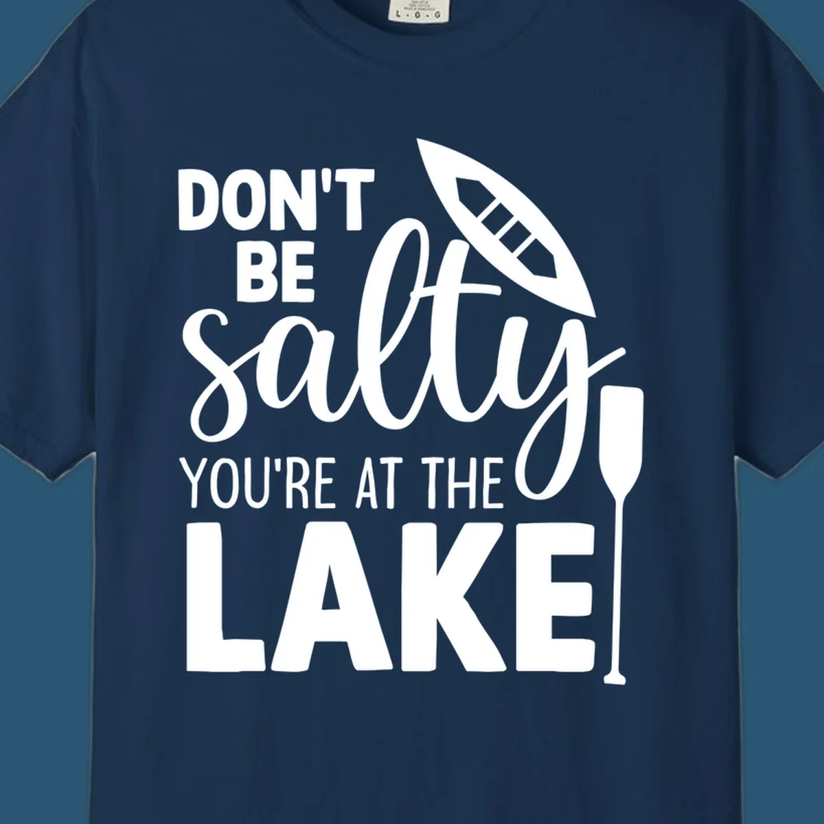 Don't be salty you're at the lake text with canoe and oar graphic.