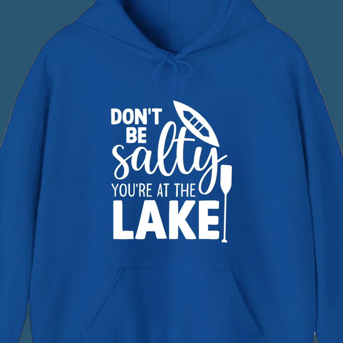 Don't be salty you're at the lake text with canoe and oar graphic.