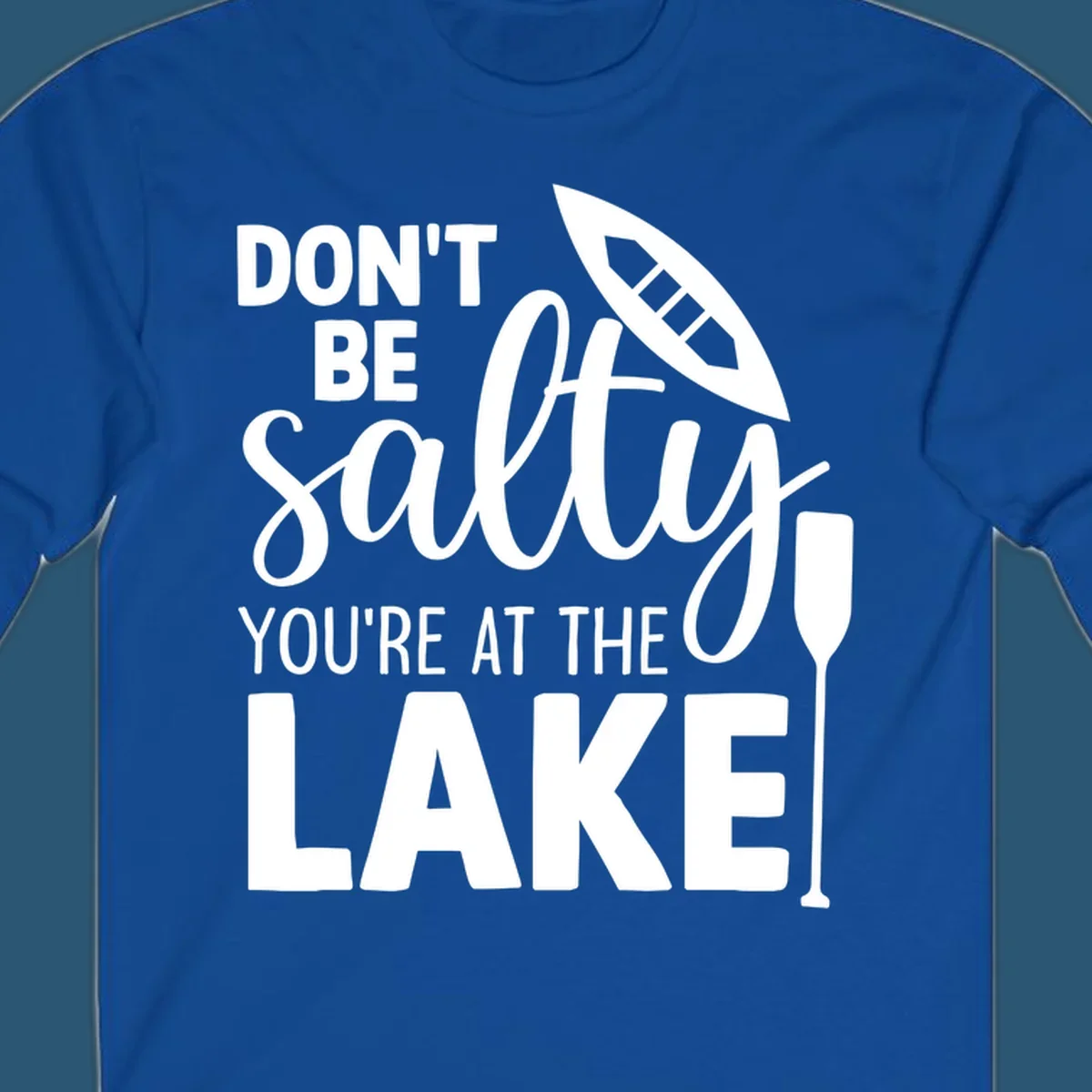 Don't be salty you're at the lake text with canoe and oar graphic.