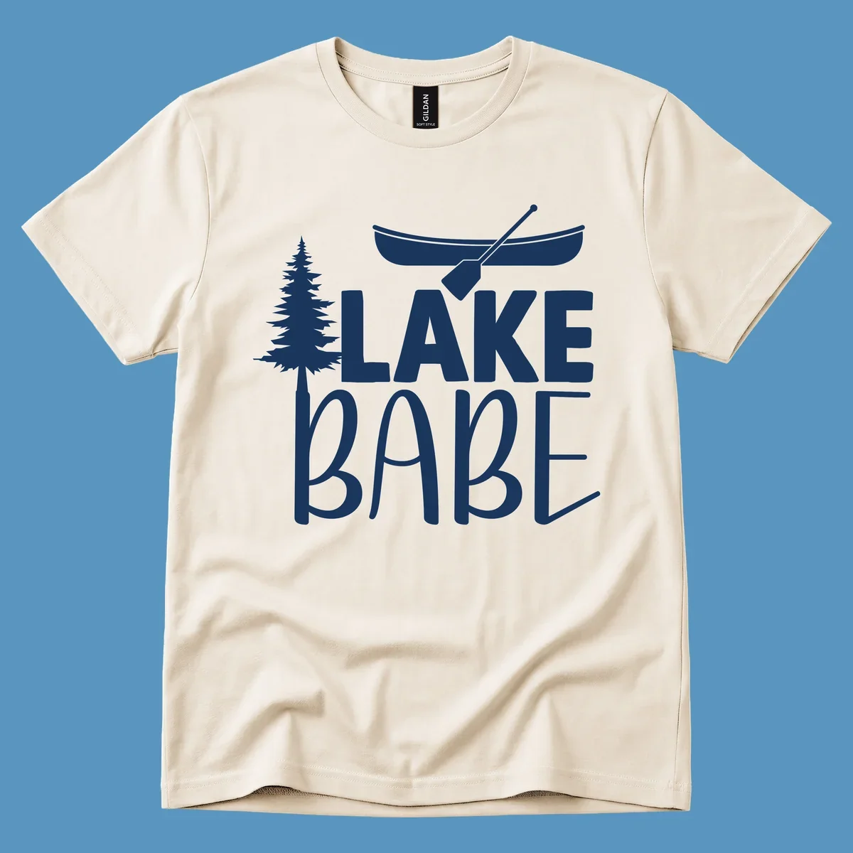Lake Babe design with canoe, pine tree, and text. Lake-babe-style graphic.