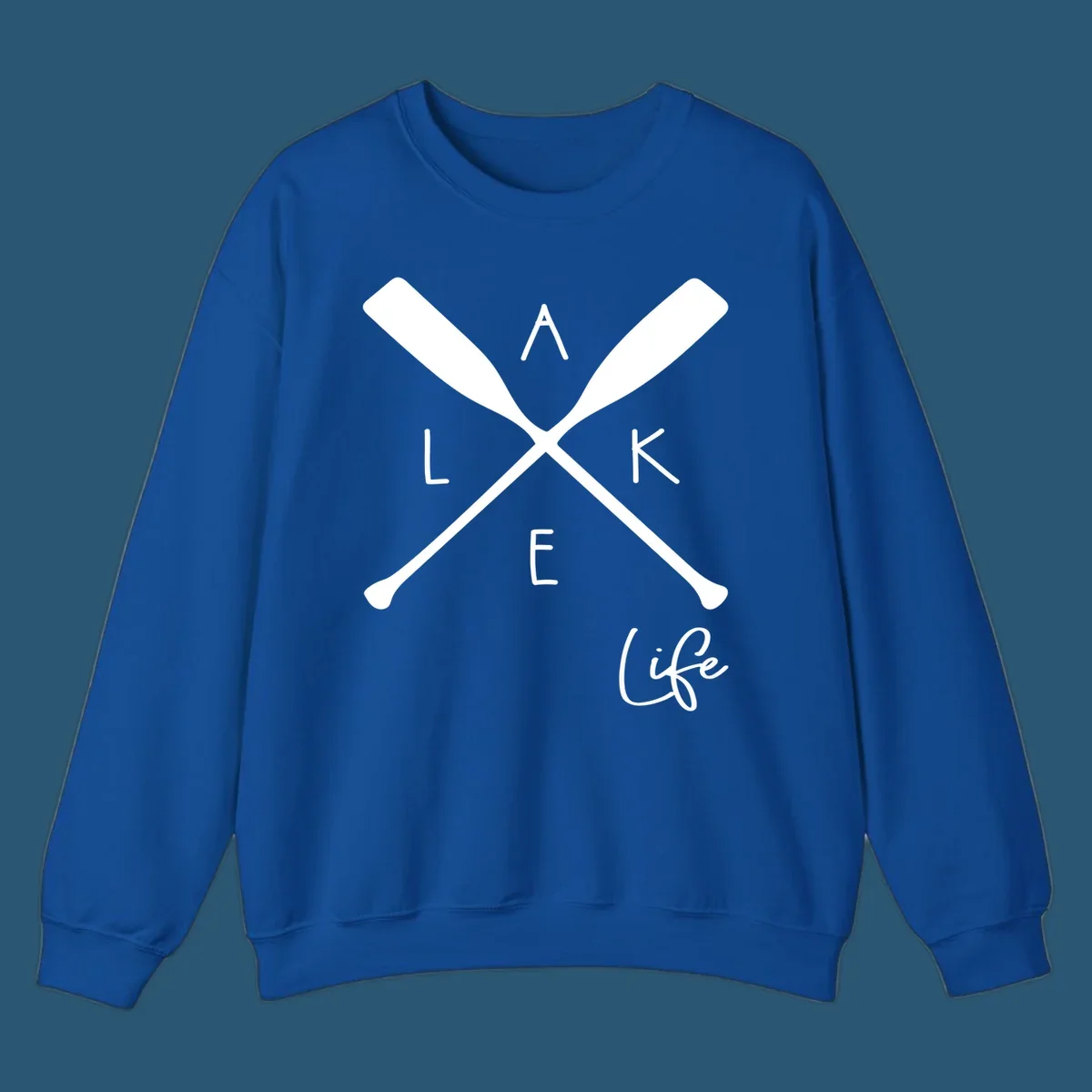 Lake life design with crossed oars and text.