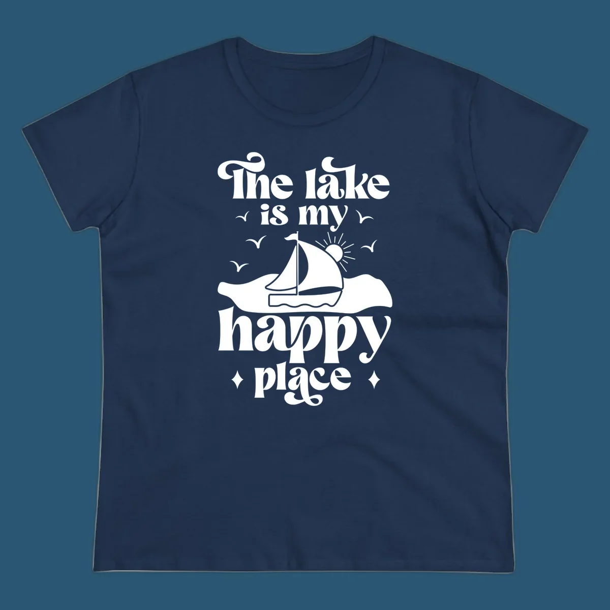 Retro text design 'The lake is my happy place' with sailboat, sun, and birds.