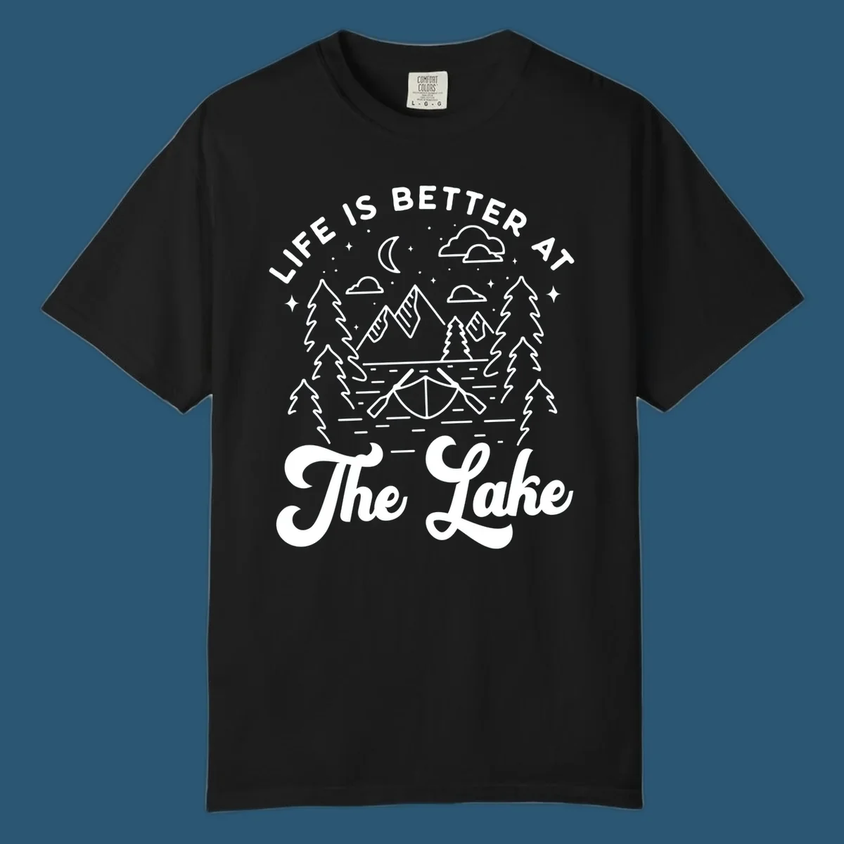 Lake life graphic with mountains, canoe, moon, and text 'Life Is Better At The Lake'.