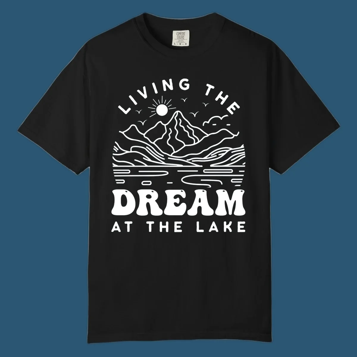 Living the dream at the lake scenic mountain landscape with sun and birds artwork.