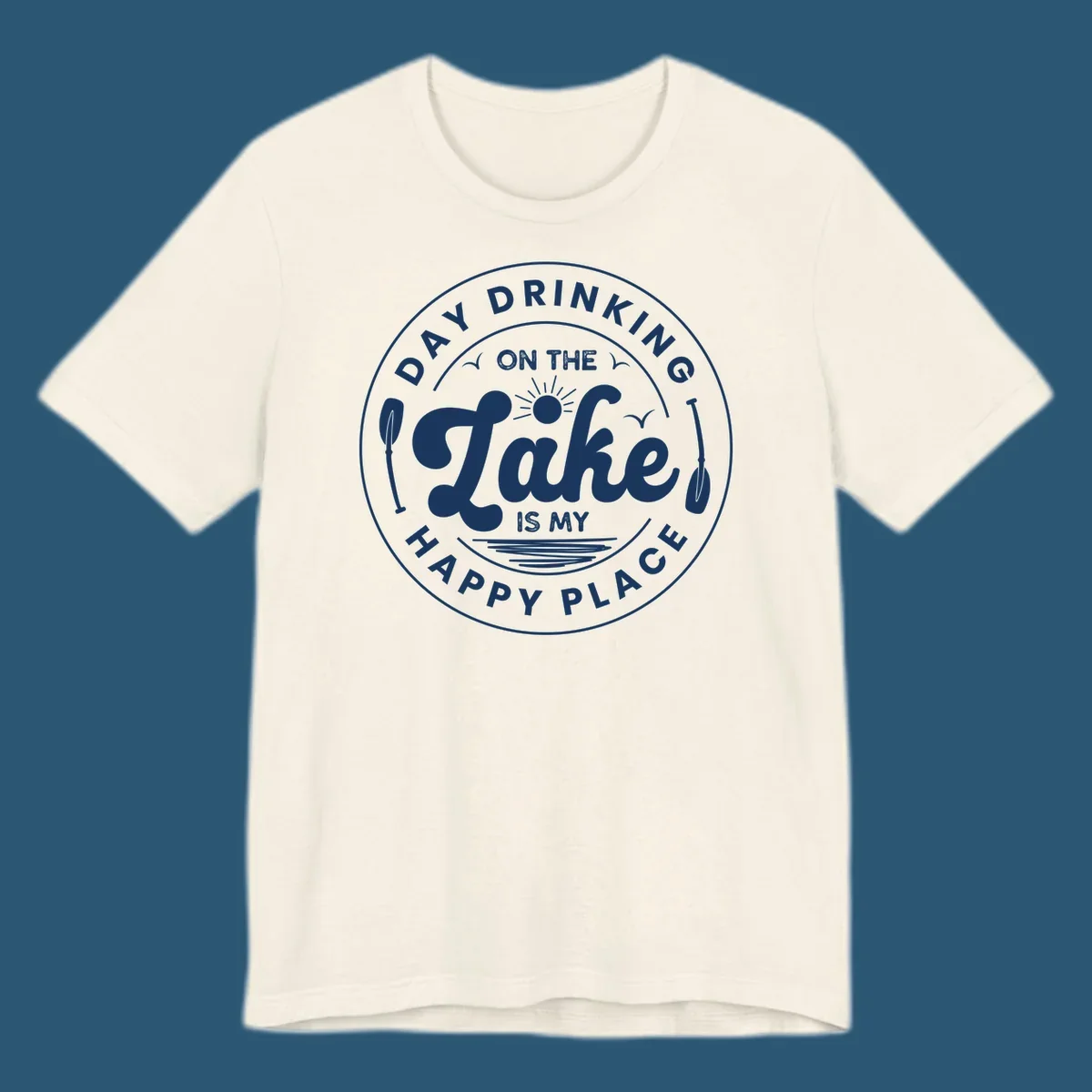 Circular badge design with text 'Day Drinking On The Lake Is My Happy Place' and lake-themed graphics.