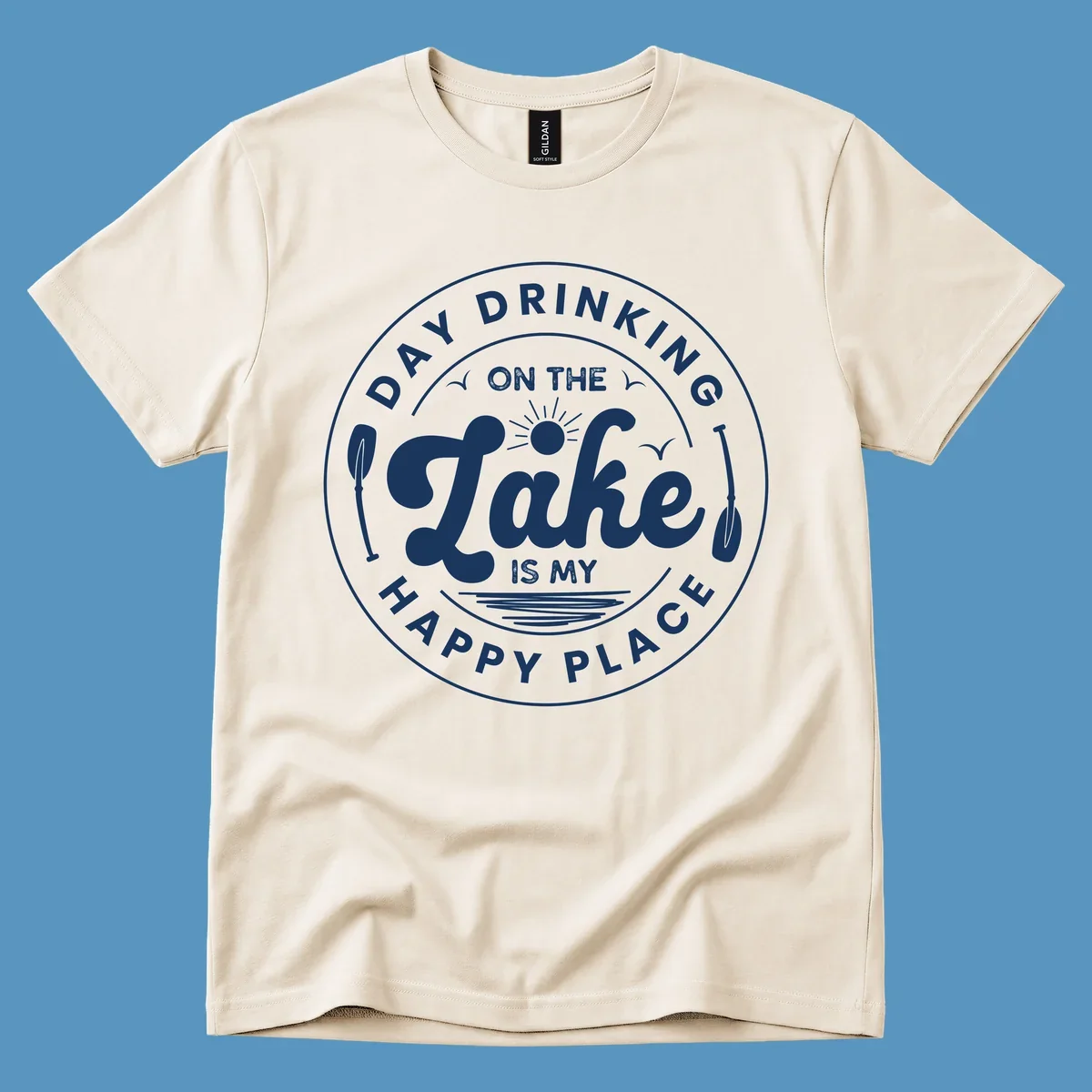 Circular badge design with text 'Day Drinking On The Lake Is My Happy Place' and lake-themed graphics.