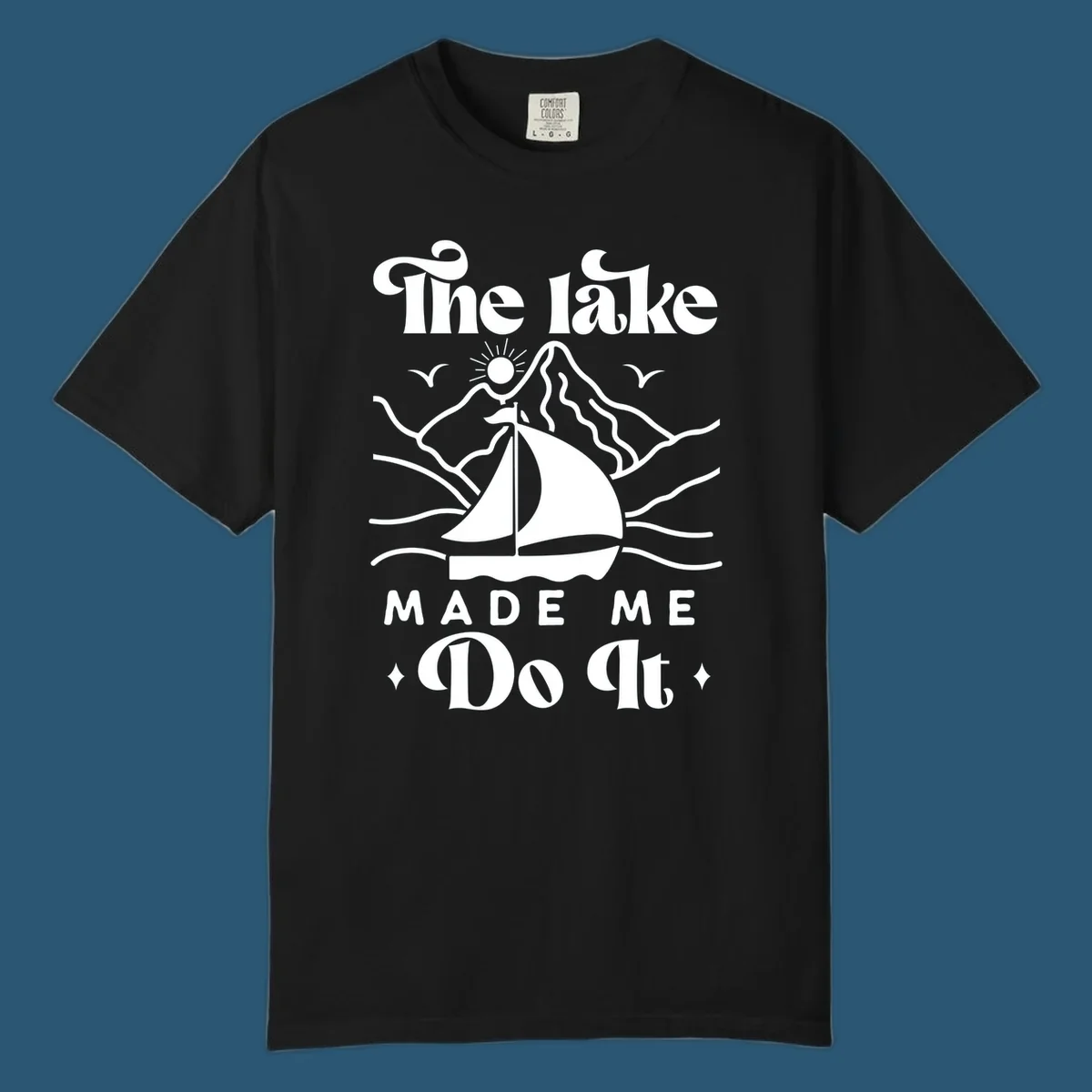 The lake Made Me Do It sailboat illustration with mountains and birds, lake-made-me-do-it concept.