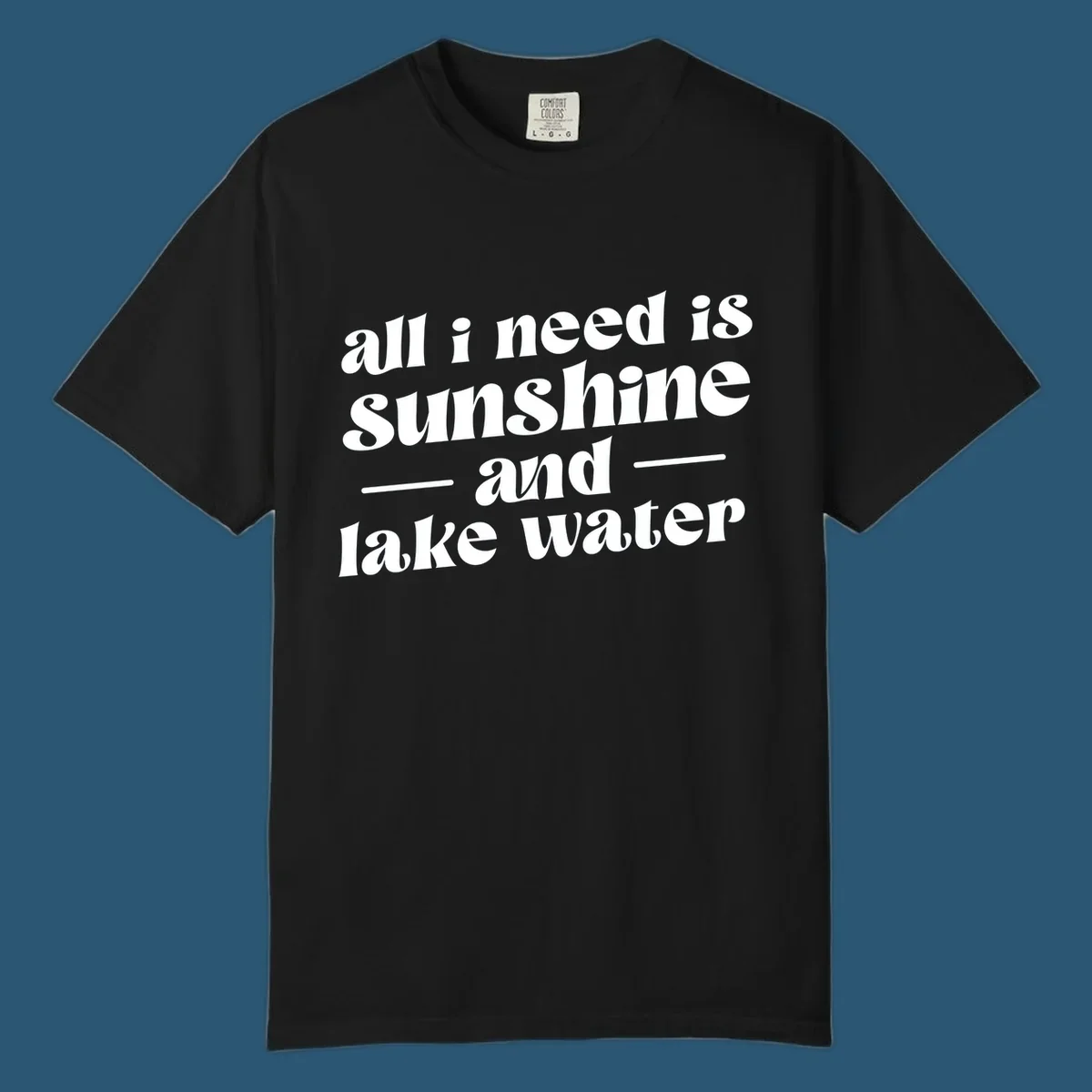 Text design 'all i need is sunshine and lake water' in a retro font, perfect for lake days.