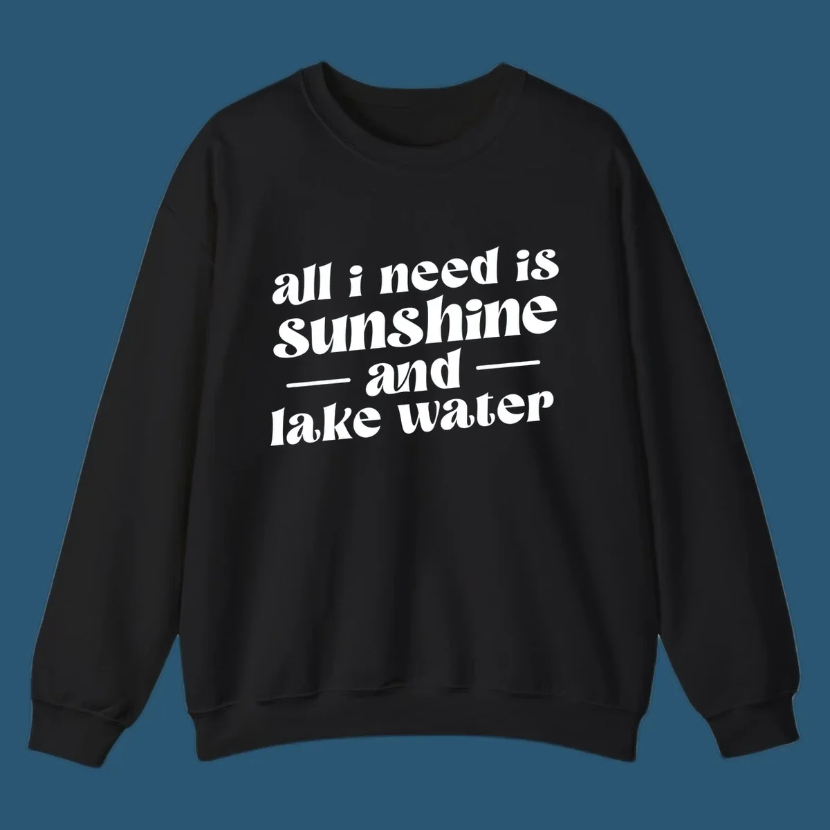 Text design 'all i need is sunshine and lake water' in a retro font, perfect for lake days.