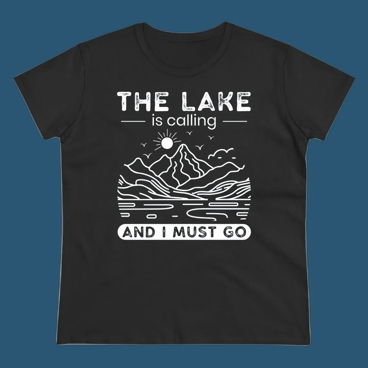 The Lake is Calling And I Must Go scenic nature design with mountains and lake.