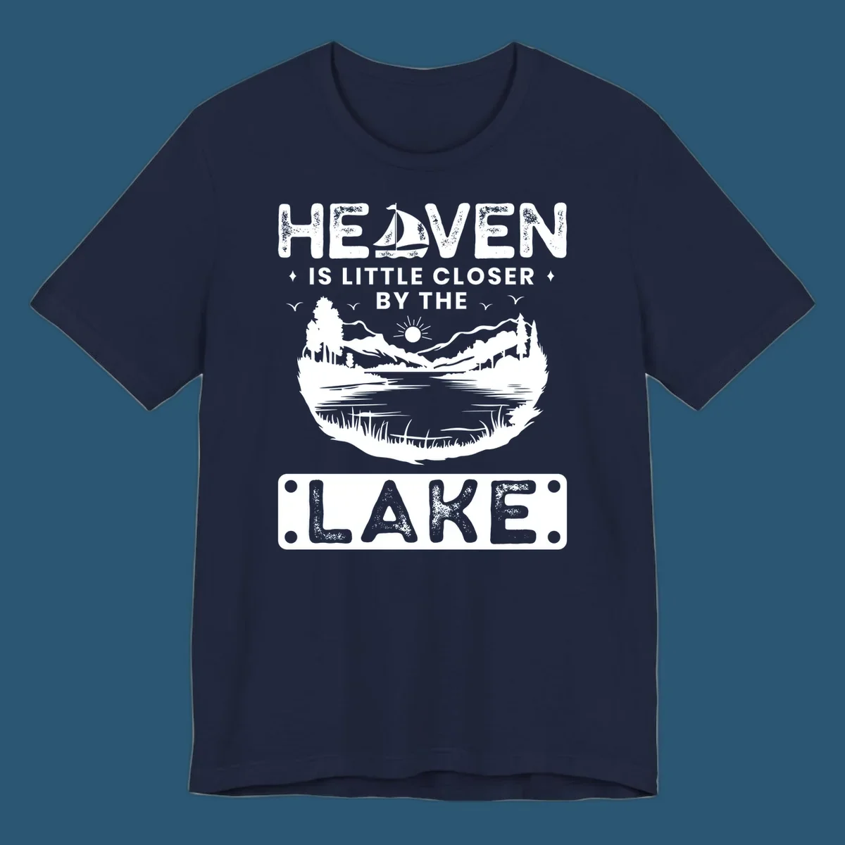 Heaven Is Little Closer By The Lake scenic design with lake, mountains, and sailboat.