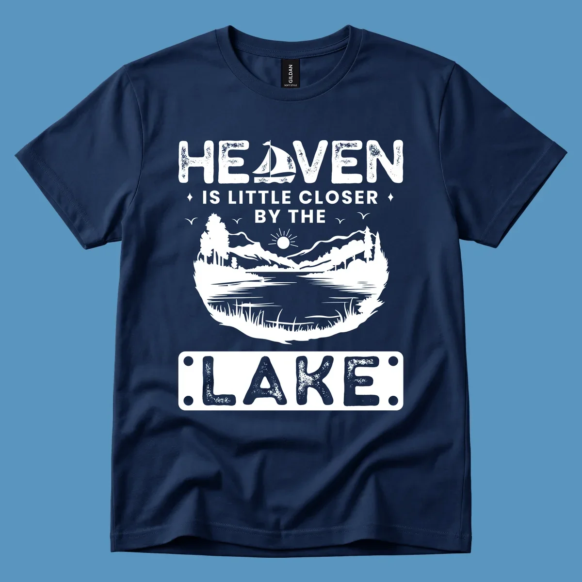 Heaven Is Little Closer By The Lake scenic design with lake, mountains, and sailboat.