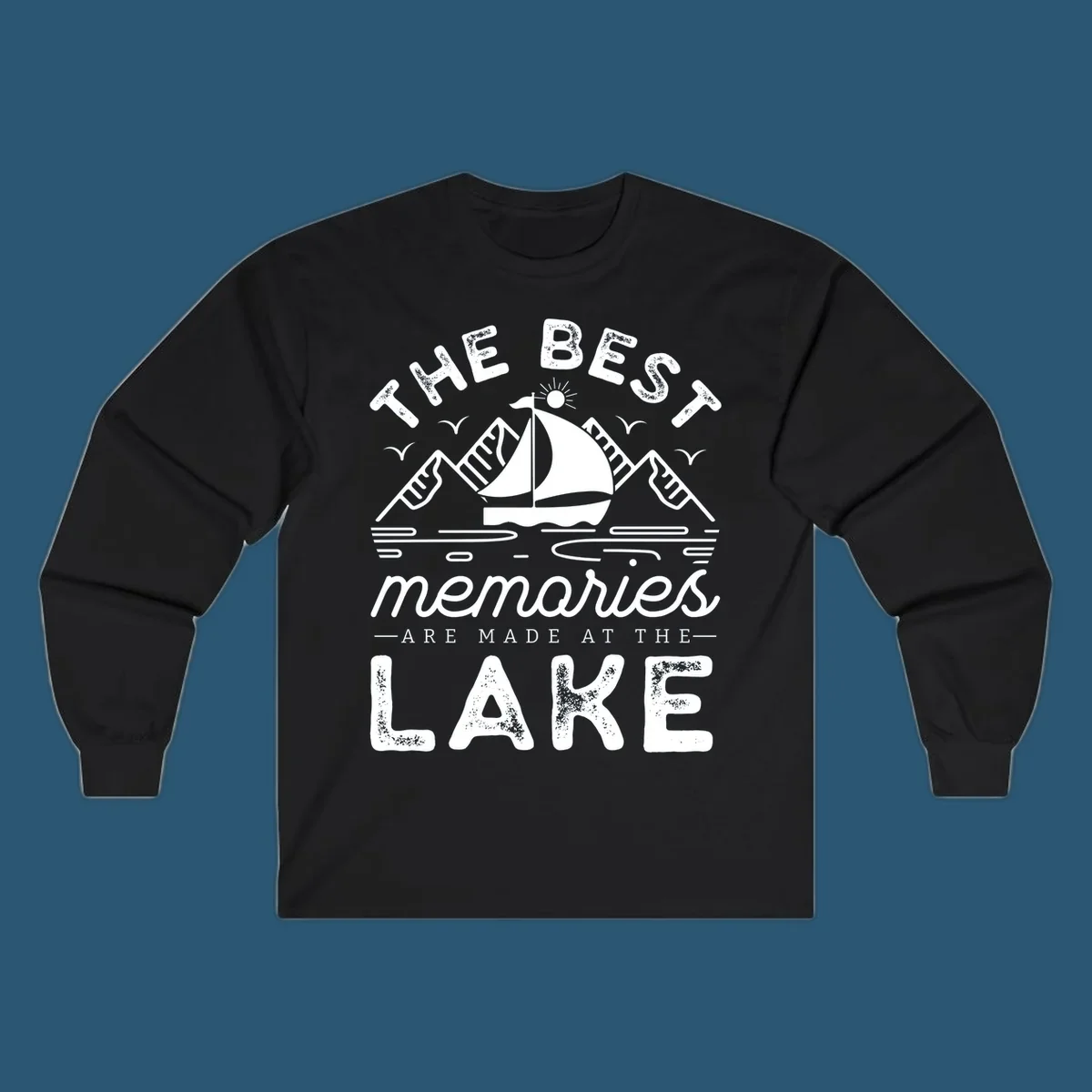 The Best Memories Are Made At The Lake design with mountains, sailboat, and text.