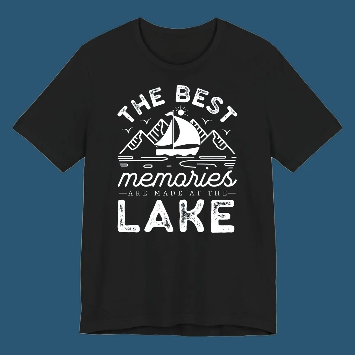 The Best Memories Are Made At The Lake design with mountains, sailboat, and text.