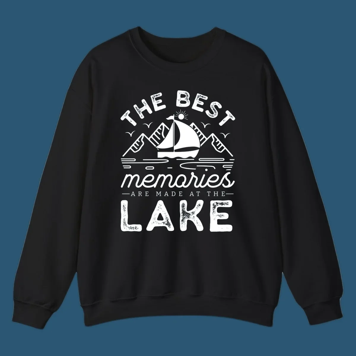 The Best Memories Are Made At The Lake design with mountains, sailboat, and text.