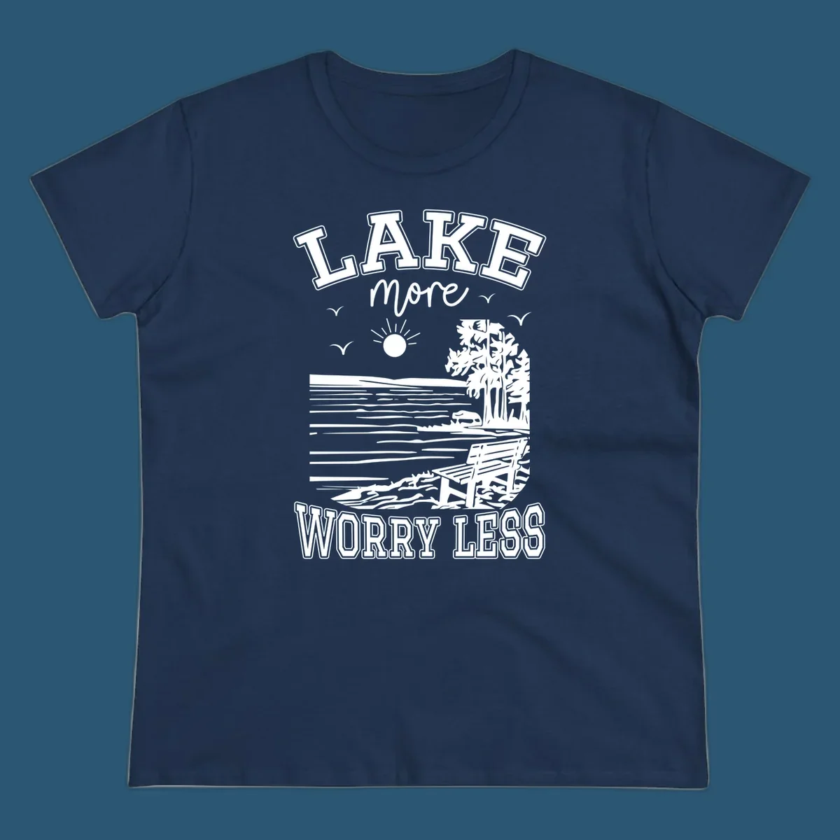 Lake More Worry Less scenic illustration with lake, trees, bench, and sun, white text on black, navy text on white.