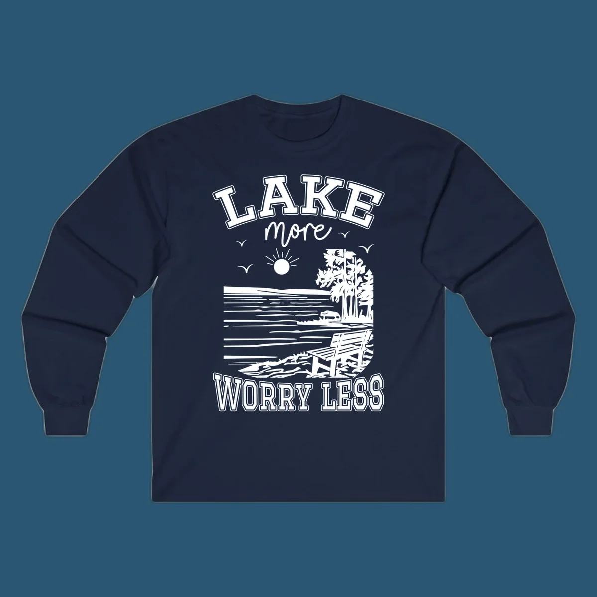 Lake More Worry Less scenic illustration with lake, trees, bench, and sun, white text on black, navy text on white.