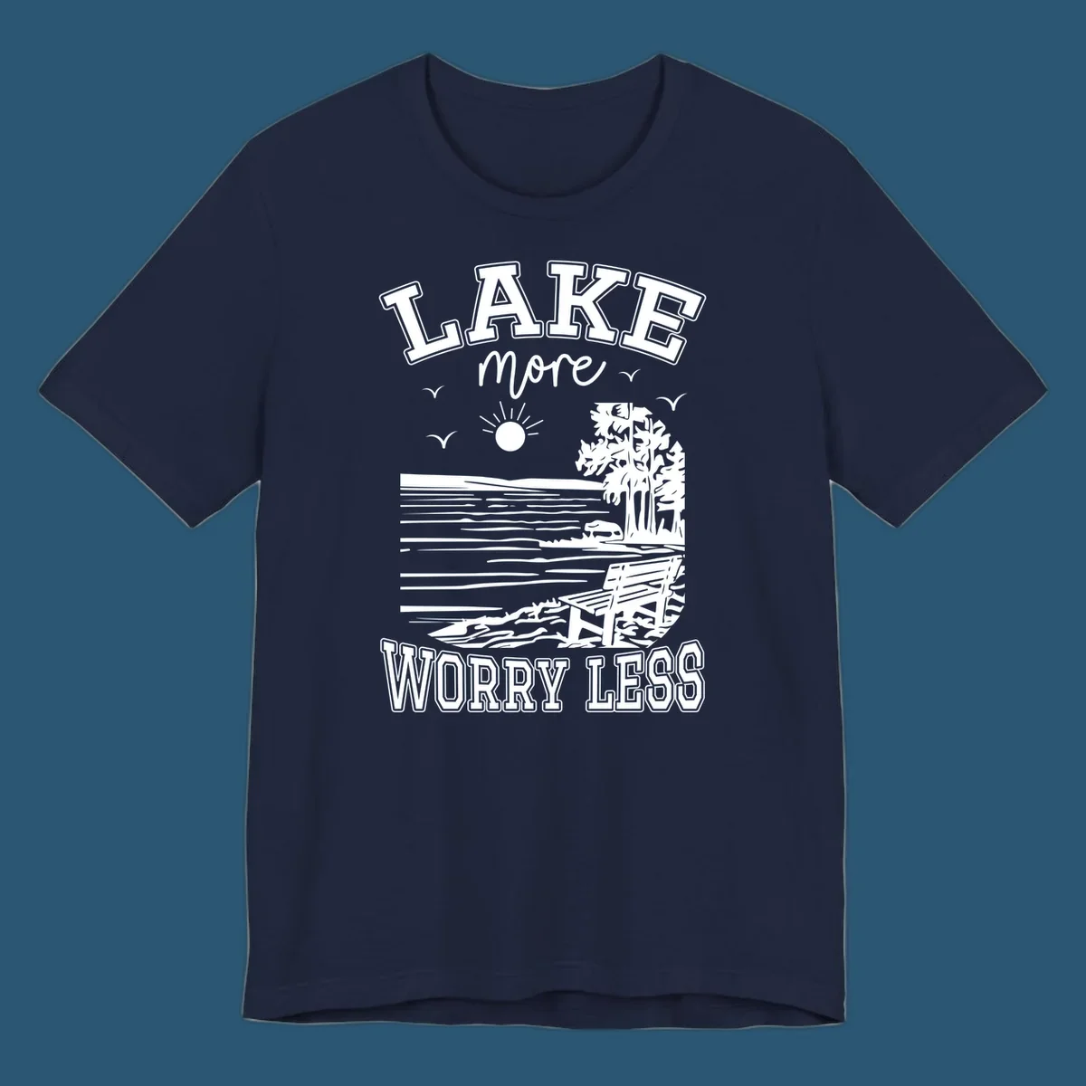 Lake More Worry Less scenic illustration with lake, trees, bench, and sun, white text on black, navy text on white.